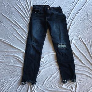 Dark wash ripped knee jeans